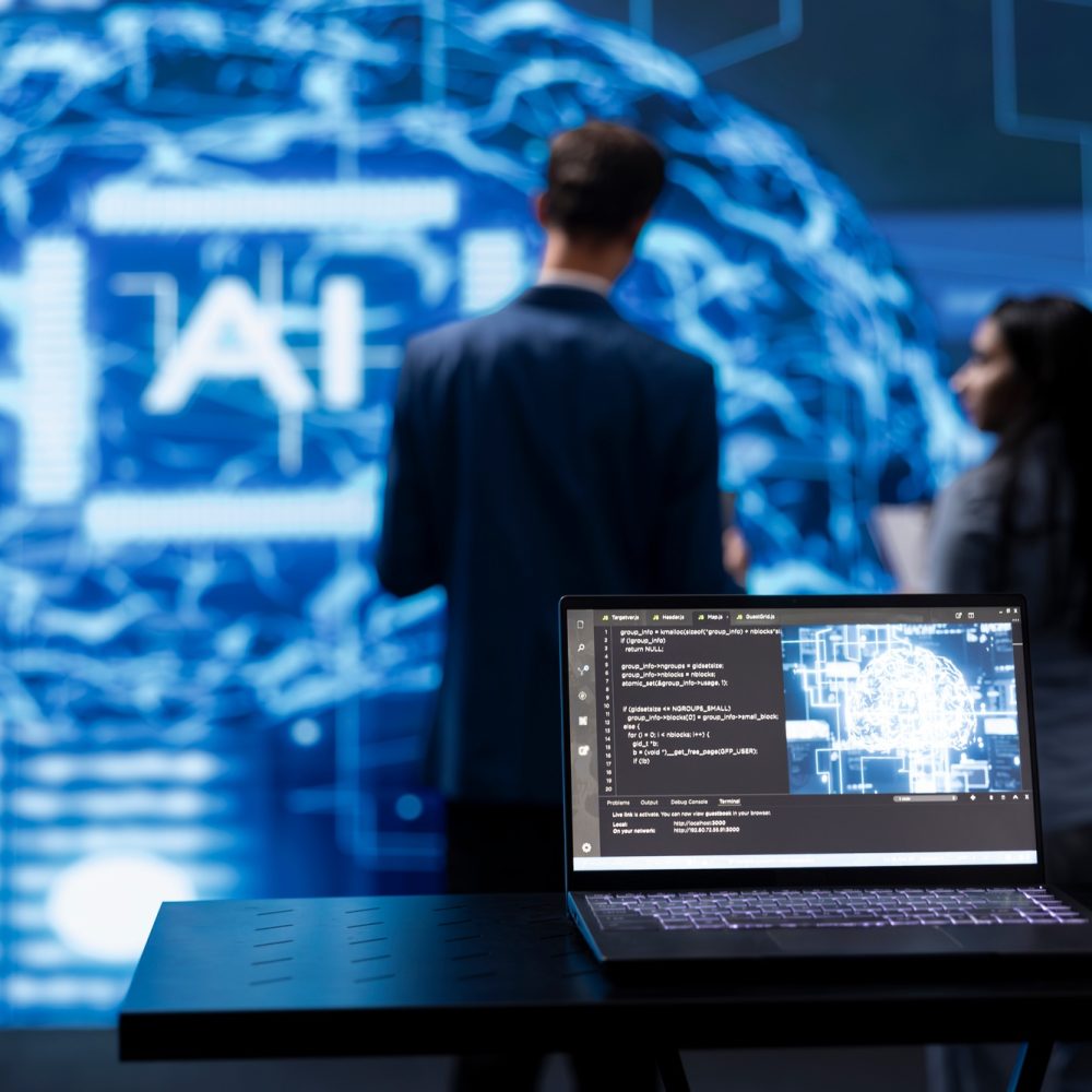 Focus on laptop running AI cognitive computing tech used by IT staff members